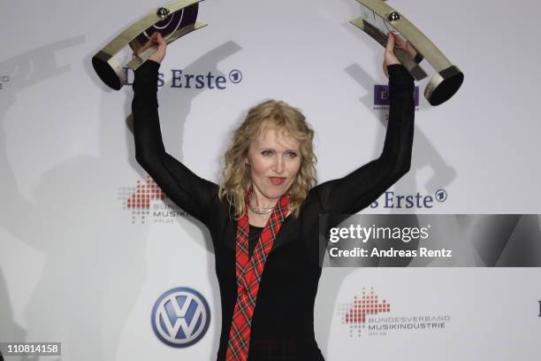 Annette Humpe poses with her award during the Echo award 2011 at Palais am Funkturm on March 24, 2011 in Berlin, Germany.