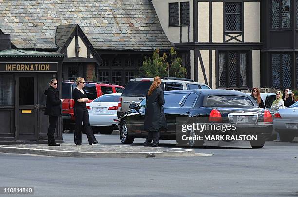 Family members arrive at the Forest Lawn Memorial Park in Glendale, California for the funeral of screen legend Elizabeth Taylor, March 24, 2011....