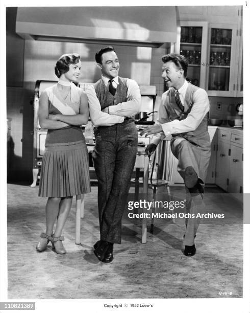 Actors, singers and dancers Debbie Reynolds, Gene Kelly and Donald O'Connor in a scene from the Loew's/MGM movie 'Singing In The Rain' in 1952 in Los...