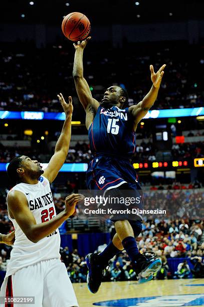 Kemba Walker of the Connecticut Huskies drives to the basket against Chase Tapley of the San Diego State Aztecs during the west regional semifinal of...