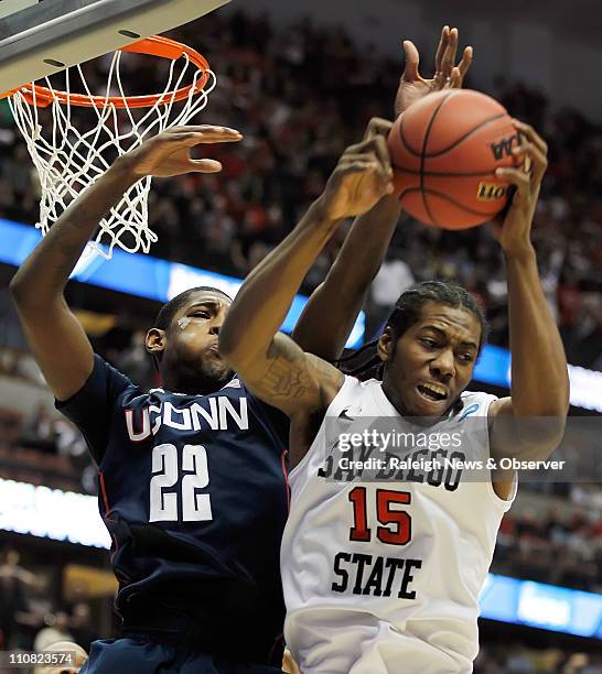 Connecticut's Roscoe Smith battles San Diego State's Kawhi Leonard for a first half rebound at the Honda Center in Anaheim, California, on Thursday...