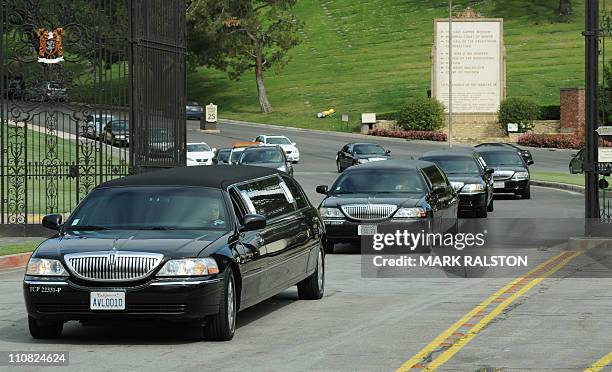 Family members leave the Forest Lawn Memorial Park in Glendale, California after the funeral of screen legend Elizabeth Taylor, March 24, 2011....