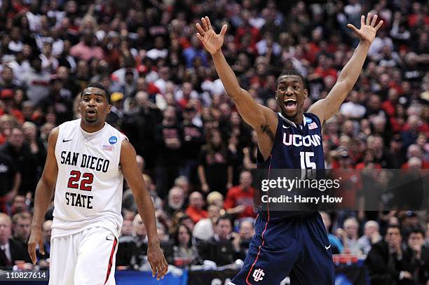 Kemba Walker of the Connecticut Huskies reacts after a play against Chase Tapley of the San Diego State Aztecs looks on during the west regional...