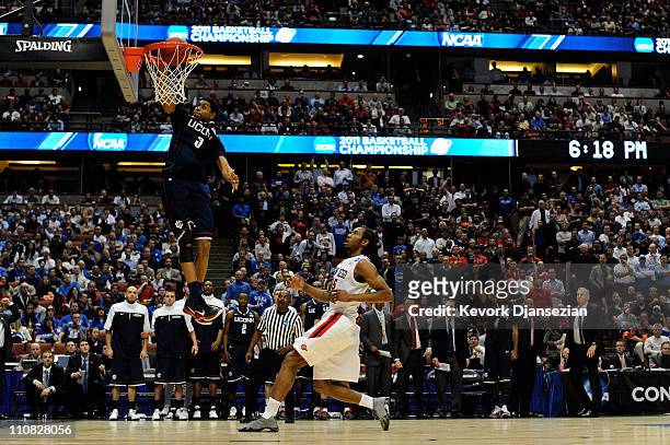 Jeremy Lamb of the Connecticut Huskies dunks the ball towards the end of the game against Kawhi Leonard of the San Diego State Aztecs during the west...