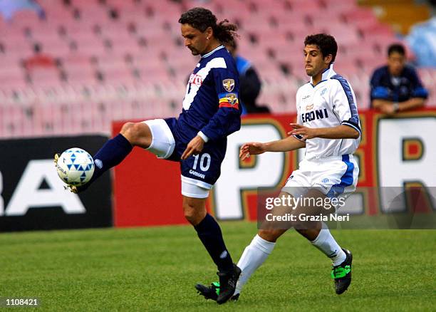 Roberto Baggio of Brescia controls the ball under pressure from Facundo Quiroga of Napoli during the Napoli v Brescia Serie A match plaued at the San...