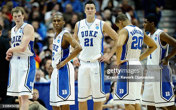 Kyle Singler, Nolan Smith, Miles Plumlee, Andre Dawkins and Kyrie Irving of the Duke Blue Devils looks on against the Arizona Wildcats during the...