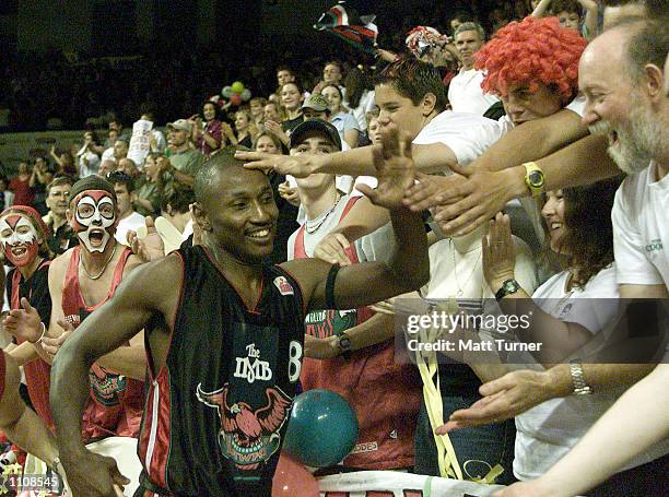 Damon Lowery of the Hawks celebrates with the crowd after the end of game 1 of the NBL Grand Final Series between the Wollongong Hawks and the...