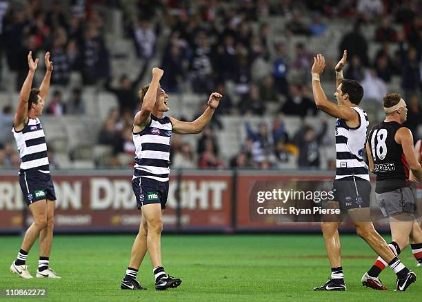 Darren Milburn and Harry Talyor of the Cats celebrate on the final siren during the round one AFL match between the Geelong Cats and the St Kilda...