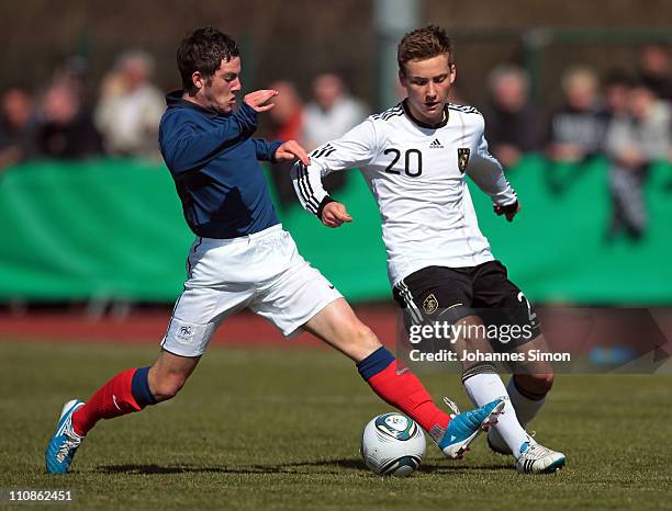 Tom Trybull of Germany and Jordan Veretout of France compete for the ball during the U18 international friendly match between Germany and France at...