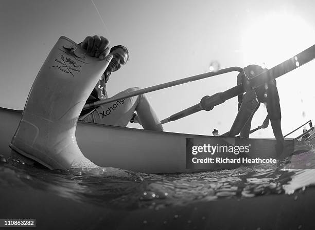 Hardy Cubasch of Cambridge tries to float his welly before they head out on a training session for the Xchanging 2011 Boat Race on The River Thames...