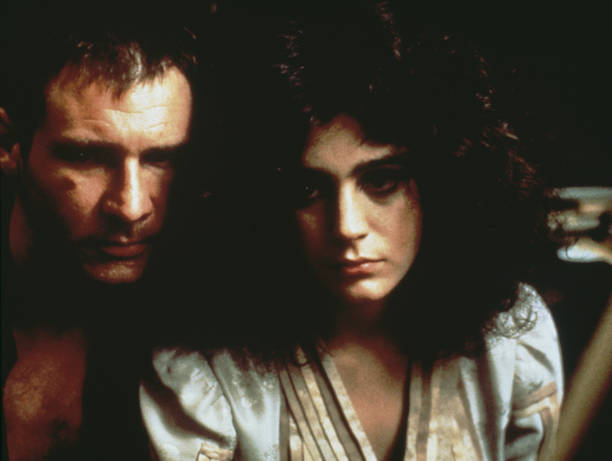 American actors Harrison Ford as Rick Deckard, and Sean Young as Rachael, in Ridley Scott's futuristic thriller 'Blade Runner', 1982.