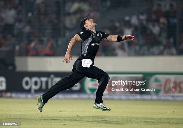Nathan McCullum of New Zealand runs for an attempted catch during 2011 ICC World Cup Quarter-Final match between New Zealand and South Africa at...