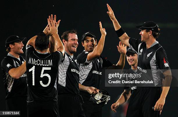 Jacob Oram of New Zealand celebrates with team mates after taking the catch to dismiss Dale Steyn of South Africa off the bowling of Nathan McCullum...