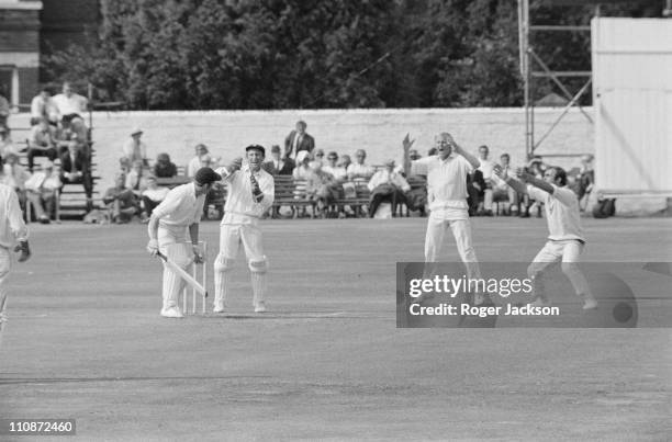 Surrey CCC cricketers Stewart Storey and John Edrich celebrating after Hampshire captain Richard Gilliat was caught by Arnold Long during a match at...