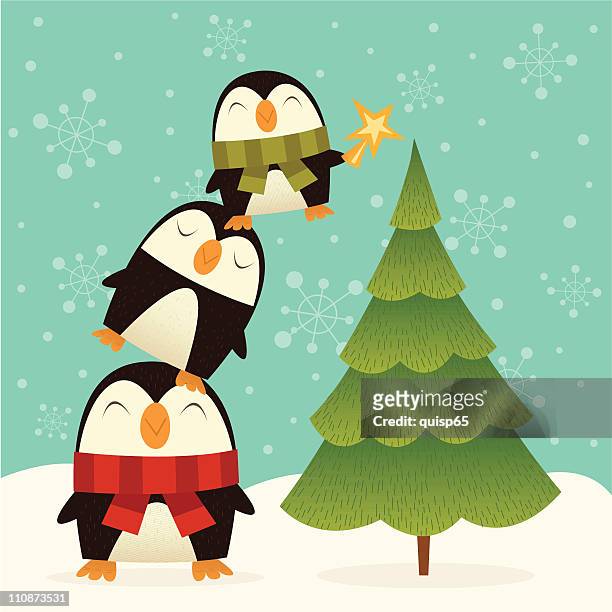 weihnachtsbaum dekorateure - pinguine stock-grafiken, -clipart, -cartoons und -symbole