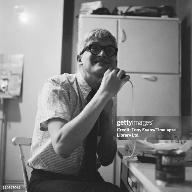 English artist David Hockney shaving, 1963.