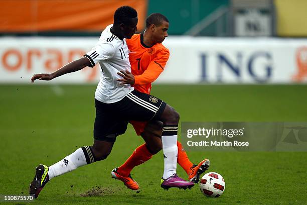 Peniel Mlapa of Germany and Luciano Narsingh of Netherlands battle for the ball during the U21 international friendly match between Germany and...