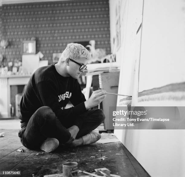 English artist David Hockney working in a studio, circa 1967.