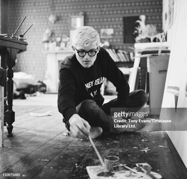 English artist David Hockney working in a studio, circa 1967.