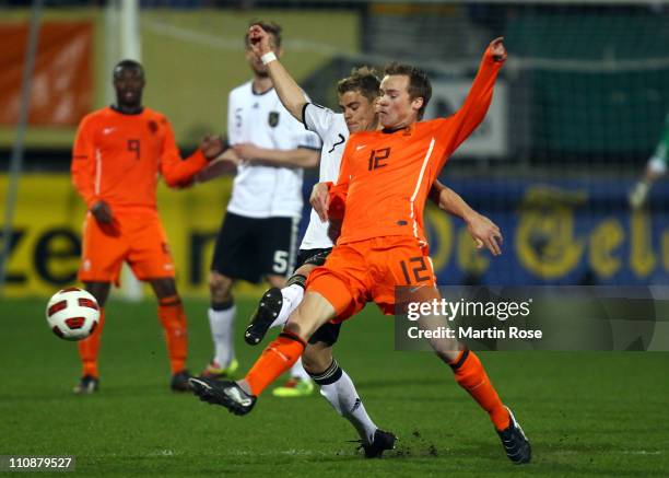 Boris Vukcevic of Germany and Maikel Kieftenbeld of Netherlands battle for the ball during the U21 international friendly match between Germany and...