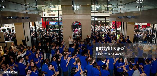 Shoppers enter to purchase the new Apple iPad 2 at Apple Store, Regent Street on March 25, 2011 in London, England. The latest iPad went on sale in...