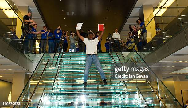 Jewels Lewis poses as the first customer to purchase the new Apple iPad 2 at Apple Store, Regent Street on March 25, 2011 in London, England. The...