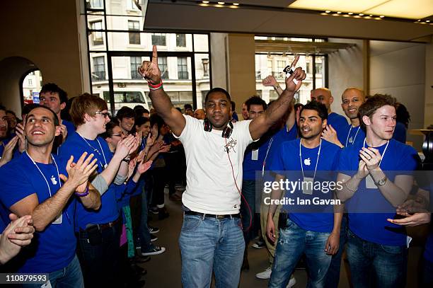 Jewels Lewis is welcomed by Apple staff as first in the queue to purchase the new Apple iPad 2 at Apple Store, Regent Street on March 25, 2011 in...