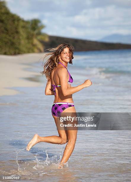 girl in bikini running on beach. - puerto rican haircut stock pictures, royalty-free photos & images