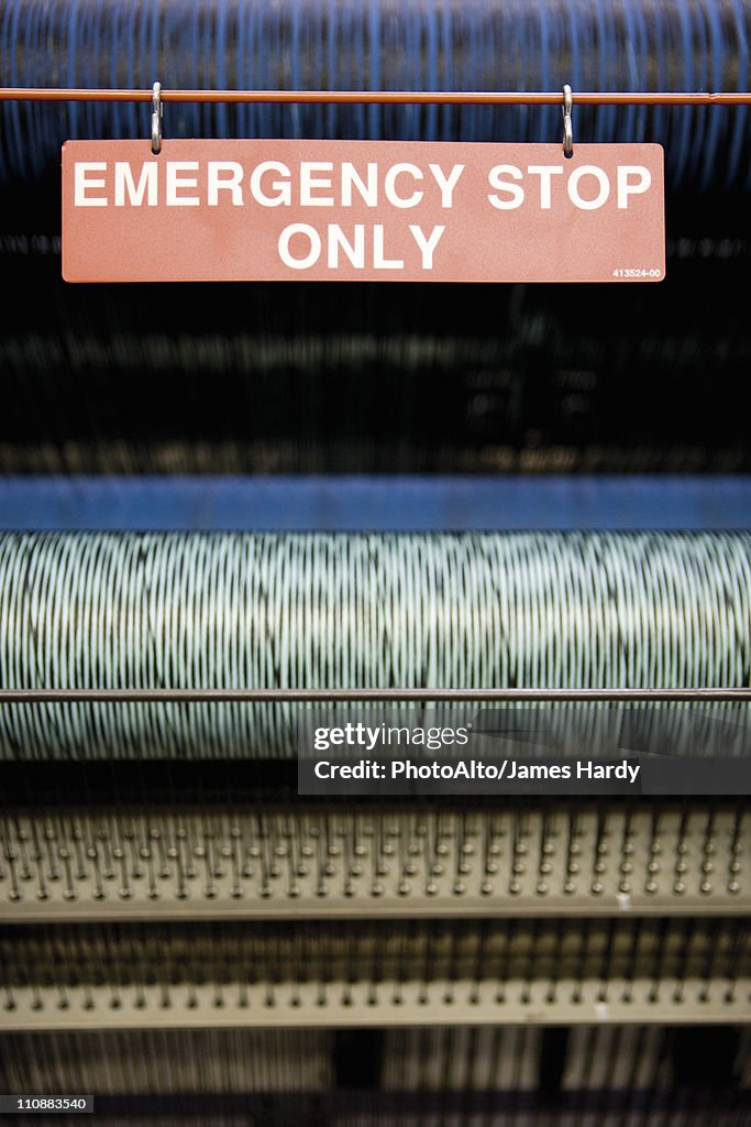 Emergency stop on weaving machine in carpet tile factory