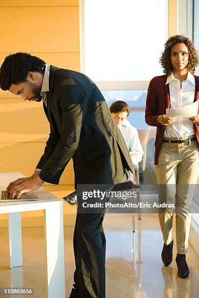 executives busy at work - bending over stock pictures, royalty-free photos & images