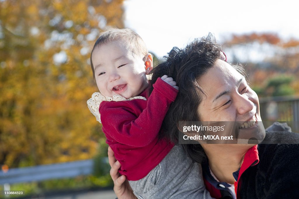 Baby Girl Pulling Father's Hair