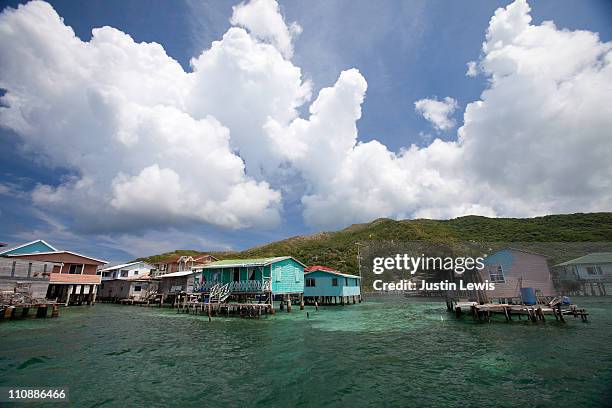 a village on stilts on guanaja island in honduras. - vista de la tierra fotografías e imágenes de stock