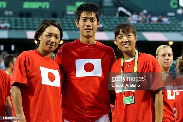 Kimiko Date-Krumm of Japan, Kei Nishikori of Japan and Ayumi Morita of Japan pose for a photo as part of "Tennis Family for Japan Relief" during the...