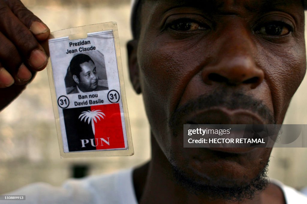 A former member of Tonton Macoute displa