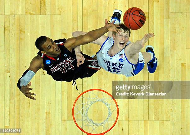 Derrick Williams of the Arizona Wildcats fights for a rebound against Kyle Singler of the Duke Blue Devils during the west regional semifinal of the...