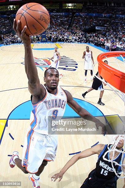 Serge Ibaka of the Oklahoma City Thunder shoots against Anthony Randolph of the Minnesota Timberwolves on March 25, 2011 at the Oklahoma City Arena...