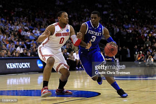 Terrence Jones of the Kentucky Wildcats drives against Jared Sullinger of the Ohio State Buckeyes during the first half of the east regional...