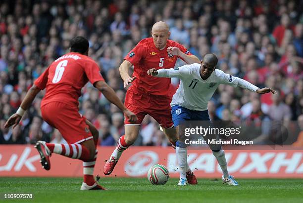 Ashley Young of England is brought down by James Collins of Wales to win a penalty during the UEFA EURO 2012 Group G qualifying match between Wales...