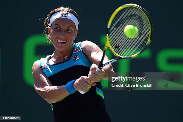 Svetlana Kuznetsova of Russia hits a backhand return against Shuai Peng of China during the Sony Ericsson Open at Crandon Park Tennis Center on March...