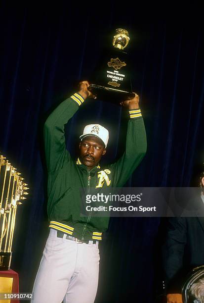 Pitcher Dave Stewart of the Oakland Athletics holds up the Most Valuble Player trophy after the A's defeated the San Francisco Giants in the 1989...