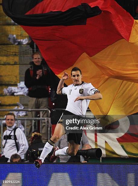 Miroslav Klose of Germany celebrates his team's first goal during the EURO 2012 Group A qualifier match between Germany and Kazakhstan at...