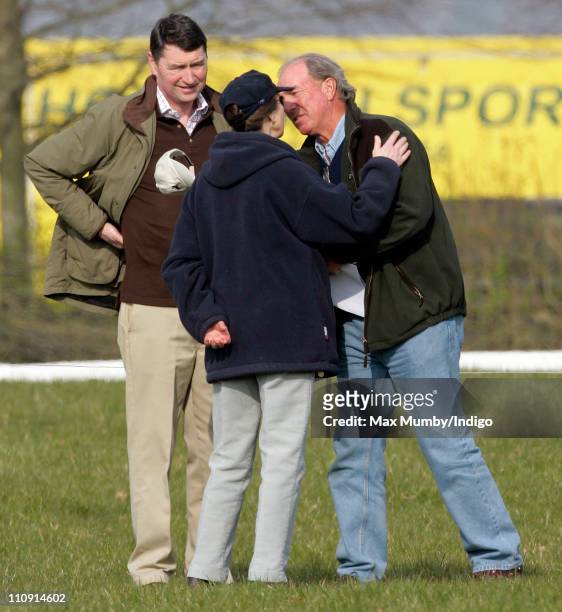 Princess Anne, The Princess Royal kisses her ex-husband Mark Phillips as her current husband Vice-Admiral Tim Laurence looks on at the Gatcombe Park...