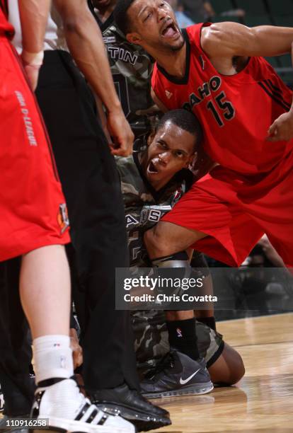 Lance Thomas of the Austin Toros suffers a seizure as Tony Bobbitt of the Idaho Stampede holds him during their game on March 26, 2011 at the Cedar...