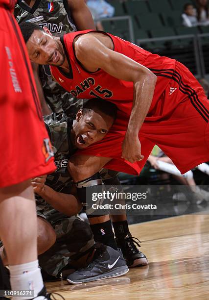 Lance Thomas of the Austin Toros suffers a seizure as Tony Bobbitt of the Idaho Stampede holds him during their game on March 26, 2011 at the Cedar...