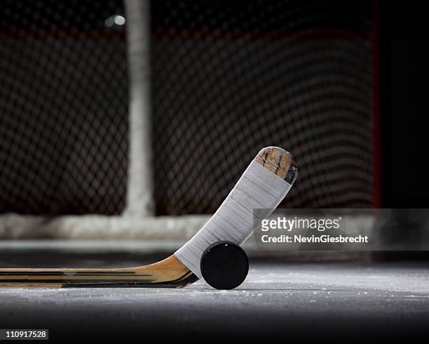 hockey puck, stick, and net (landscape) - hockey puck stock pictures, royalty-free photos & images