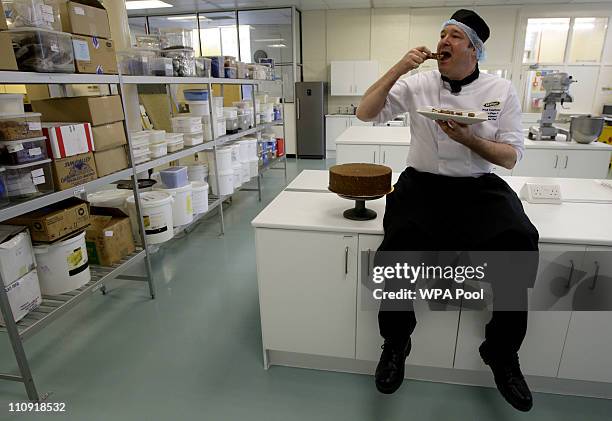 Cake Design and Development Head Chef Paul Courtney tastes a piece of a trial biscuit cake after making it at the McVitie's factory March 25, 2011 in...