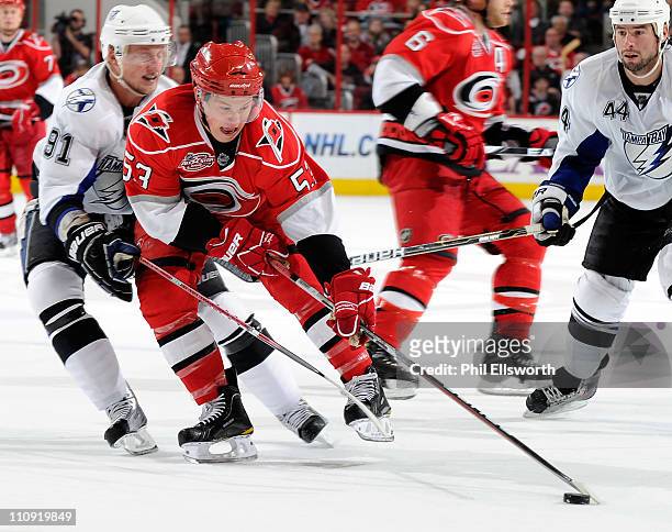 Jeff Skinner of the Carolina Hurricanes is defended by Steven Stamkos of the Tampa Bay Lightning during an NHL game on March 26, 2011 at RBC Center...