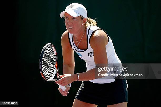 Lisa Raymond awaits a serve during her doubles match against Maria Kirilenko of Russia and Anastasia Pavlyuchenkova of Russia during the Sony...