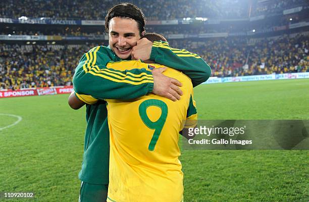 Katlego Mphela and Davide Somma of South Africa celebrate his last minute goal during the 2012 Africa Cup of Nations Qualifier match between South...