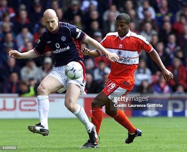 Jaap Stam of Manchester United shields the ball from Hamilton Ricard of Middlesbrough during the FA Carling Premiership game between Middlesbrough v...